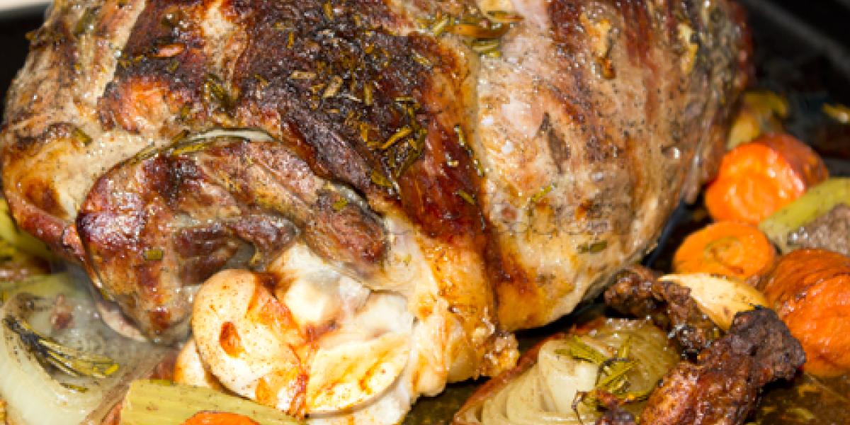 leg of lamb on a bed of vegetables